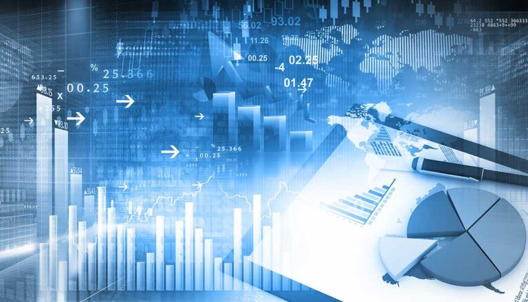 A person reviews documents at a kitchen table with tax forms, receipts, and a calculator nearby.